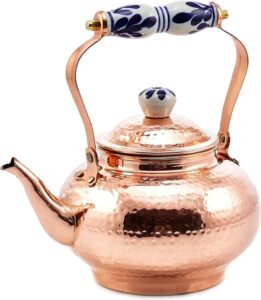 stunning old dutch kettle with decorative accents