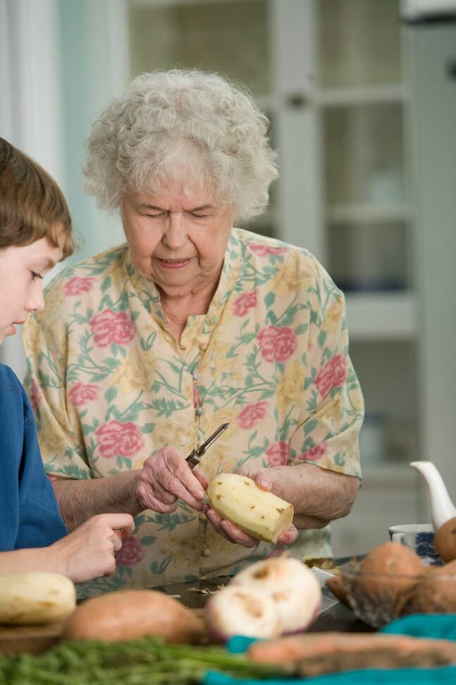 granny with knife in the kitchen