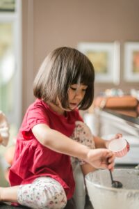 grandchildren love to help in the kitchen